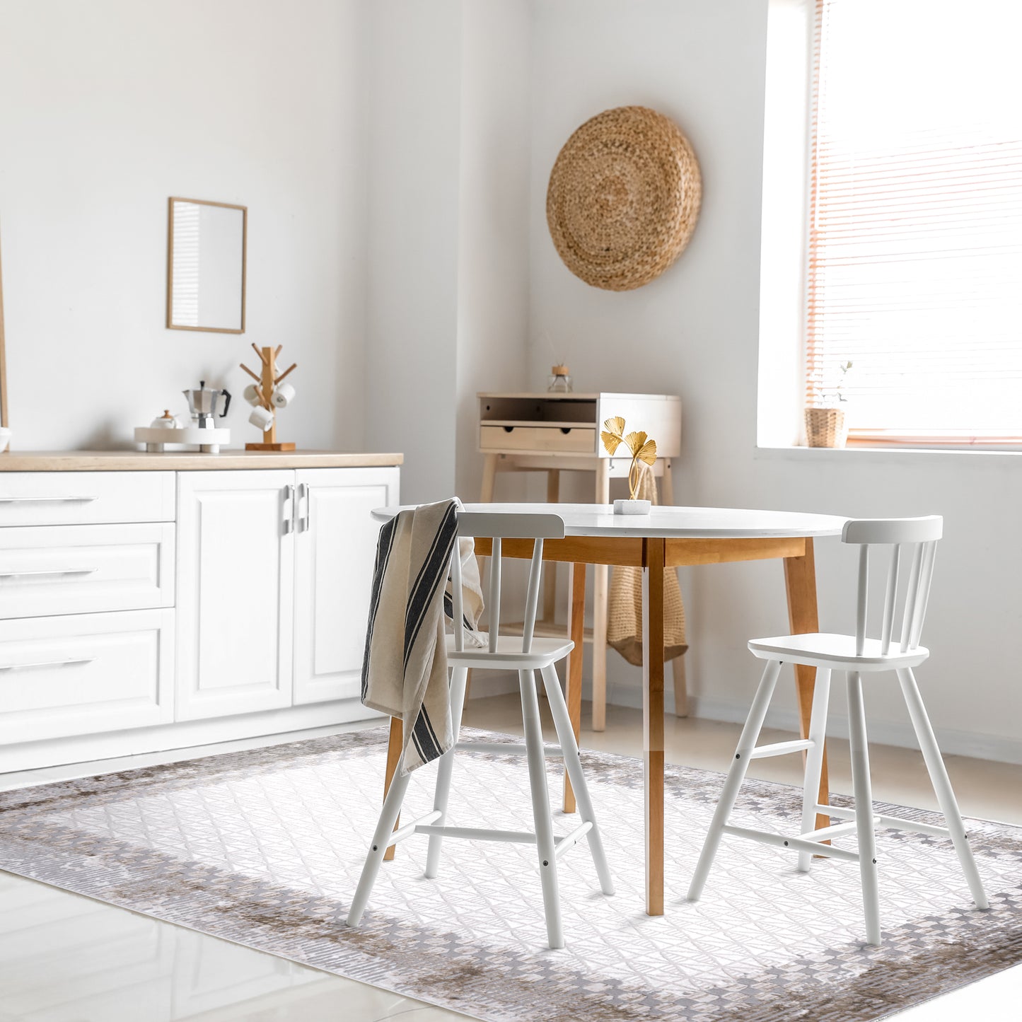 Modern scandinavian dining room with white and wooden furniture on distressed beige rug 