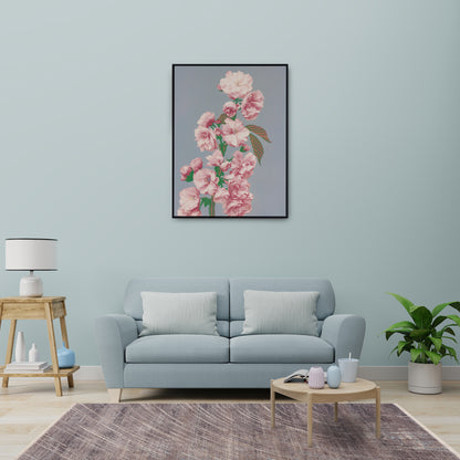 Modern living room featuring Mystic Grey Rug with distressed design on cool grey and earthy tones, wooden coffee table, side table, plant and large flower print on wall