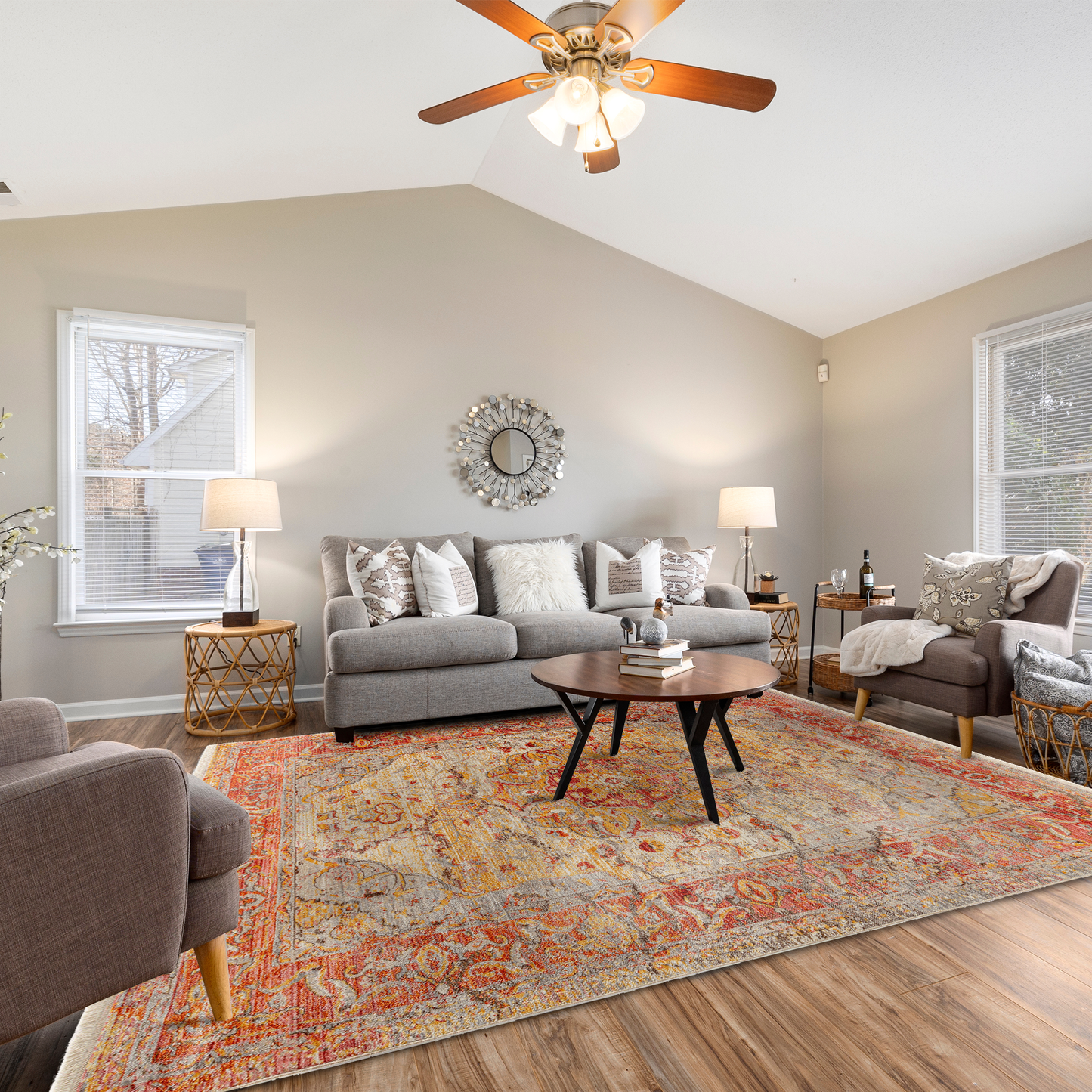 Mystic Pink Rug in a cozy living room with grey and beige sofa and armchairs, wooden accent tables and rattan baskets